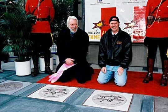 Donald Sutherland and Neil Young with stars at the 2006 Red Carpet event